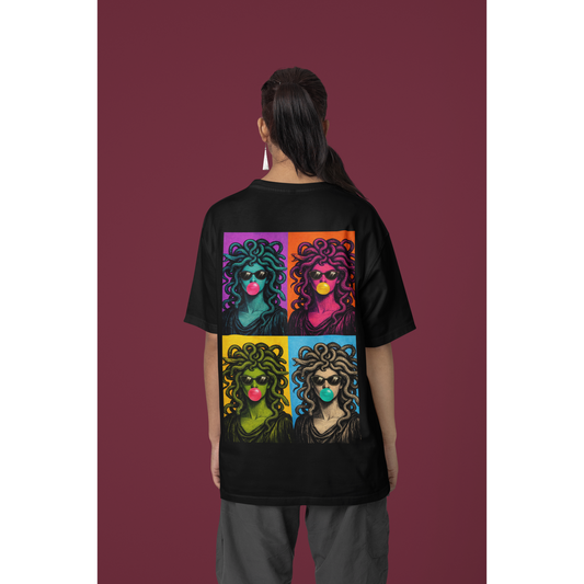 Black pop art Medusa back graphic t-shirt worn by female model, unisex statement tee featuring pop art Medusa collage artwork on the back with bold color blocks, sunglasses, and bubblegum details in a modern streetwear style