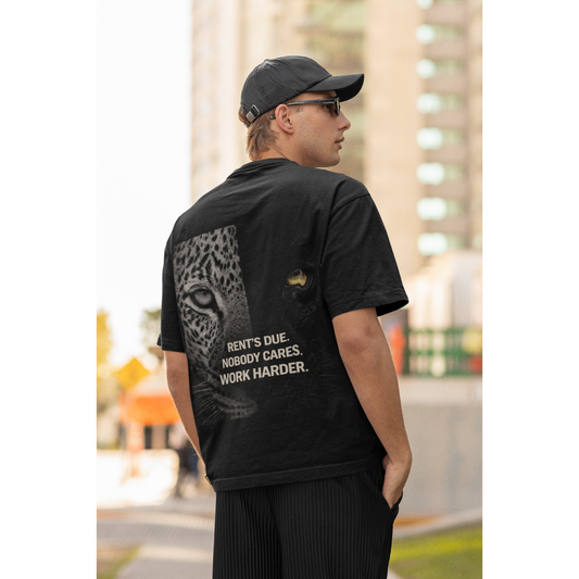 Unisex Rent’s Due black t-shirt shown on male and female models, featuring clean black front and bold leopard panther back graphic with motivational discipline quote, dark luxury streetwear tee