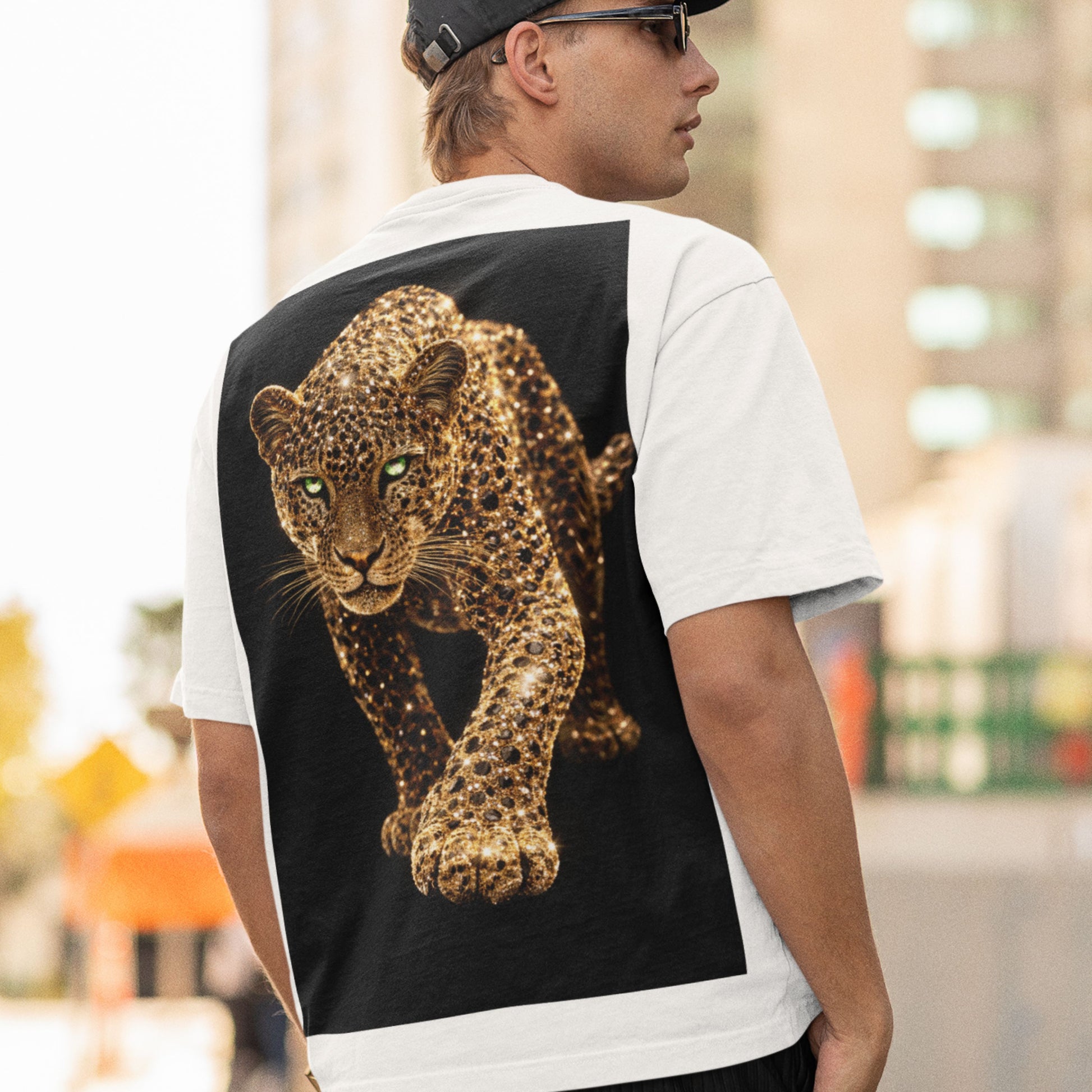 Unisex white t-shirt worn by model featuring gold leopard back graphic, luxury streetwear animal tee styled for modern urban fashion