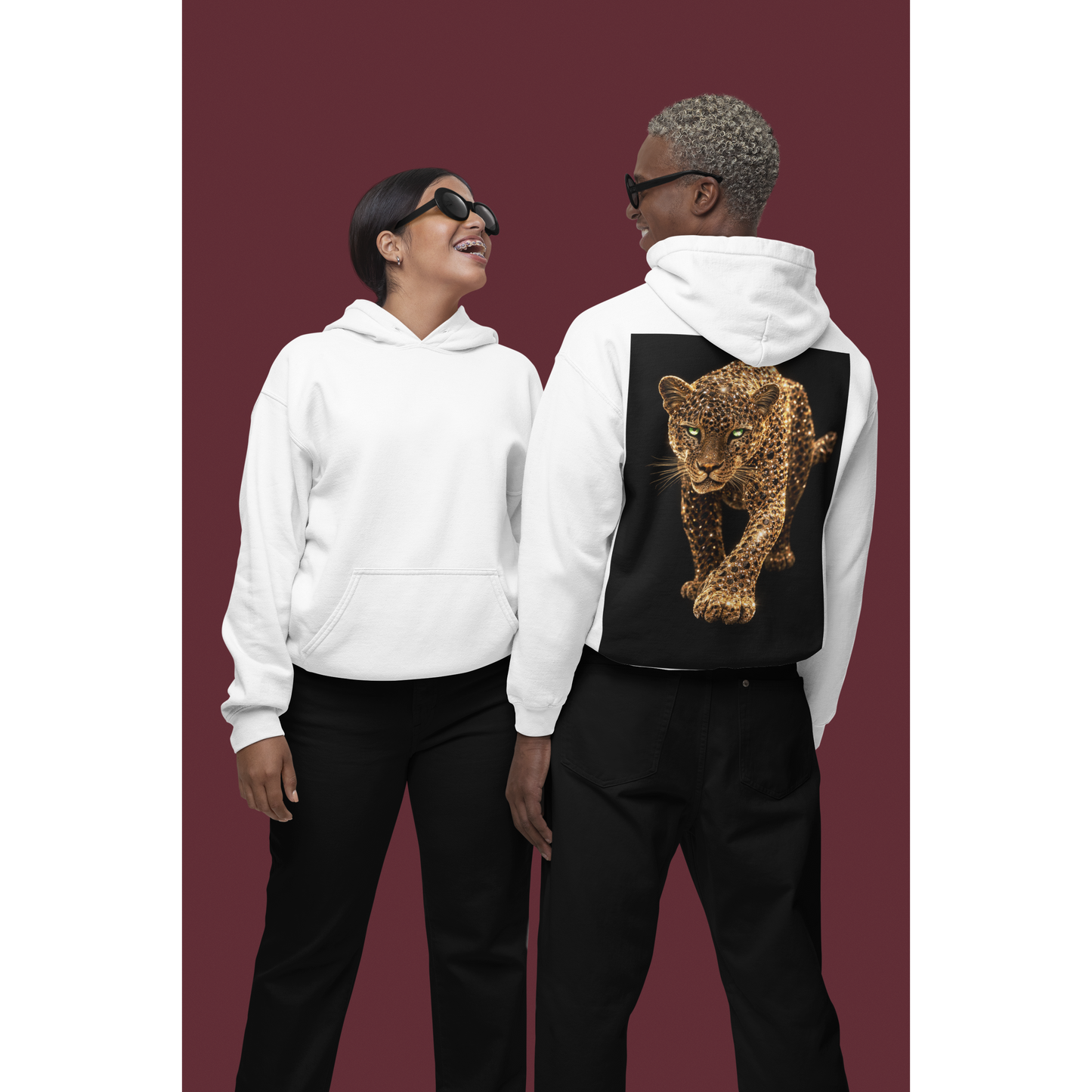 Two models wearing white hoodies, back view of one hoodie showing gold leopard back graphic, luxury unisex streetwear hoodie with bold animal artwork