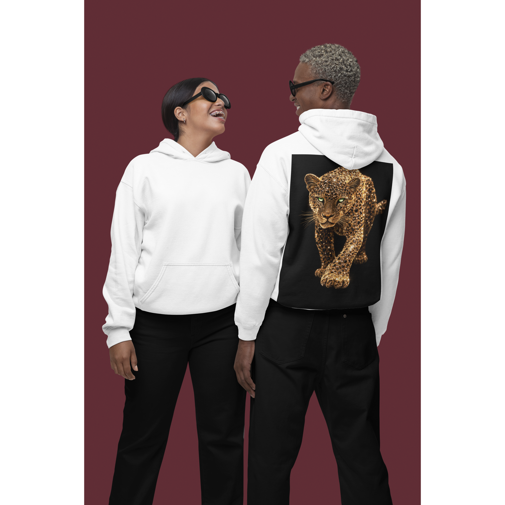 Two models wearing white hoodies, back view of one hoodie showing gold leopard back graphic, luxury unisex streetwear hoodie with bold animal artwork