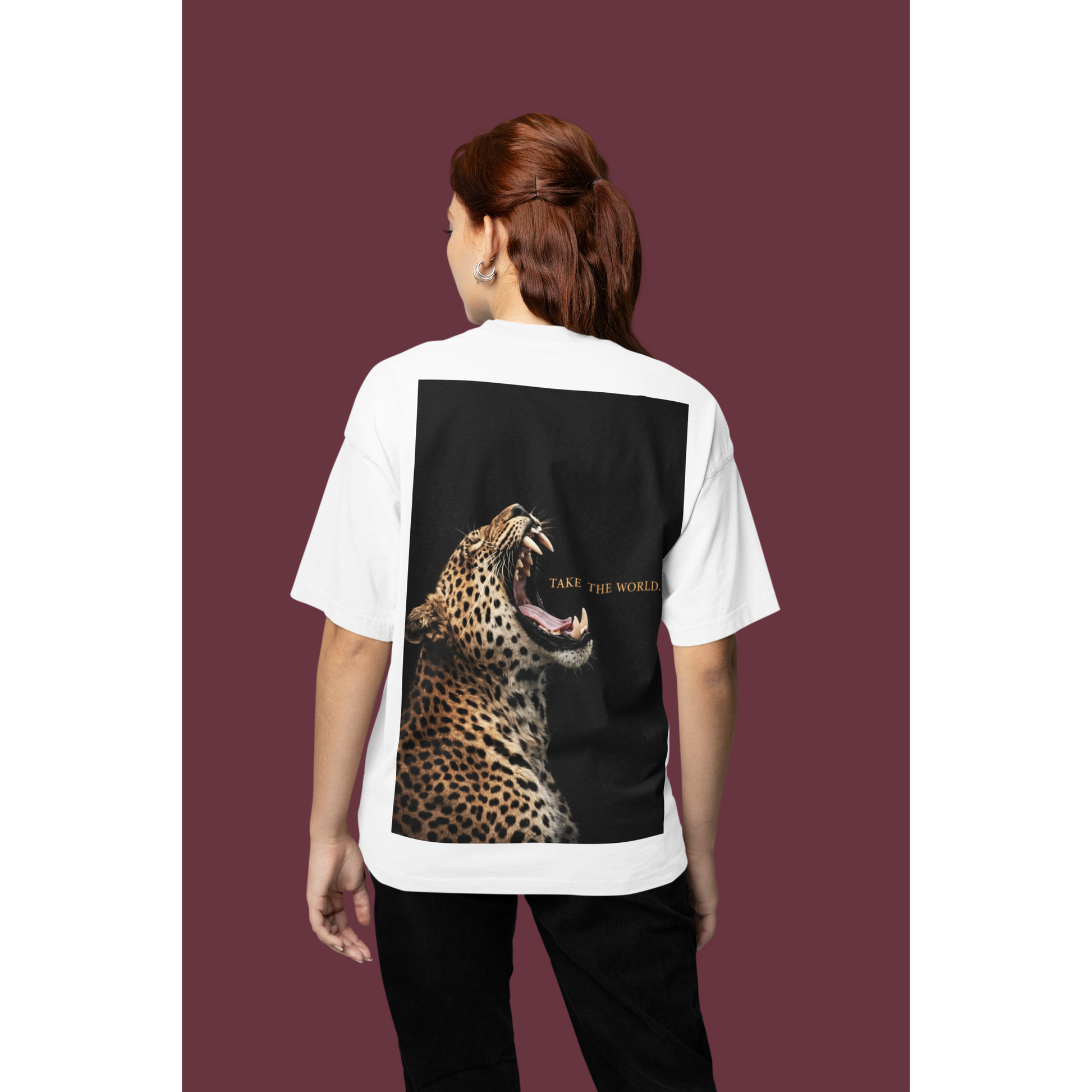 White leopard back graphic t-shirt studio back view featuring roaring leopard artwork and TAKE THE WORLD text, luxury animal fashion