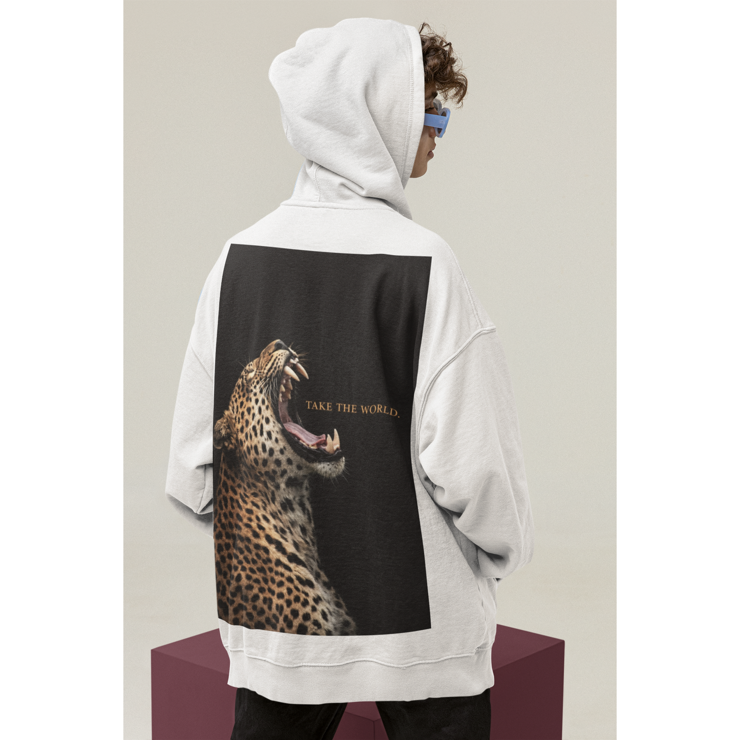 White hoodie with roaring leopard back graphic and Take the World slogan, contrast animal art hoodie blending luxury streetwear and power aesthetic