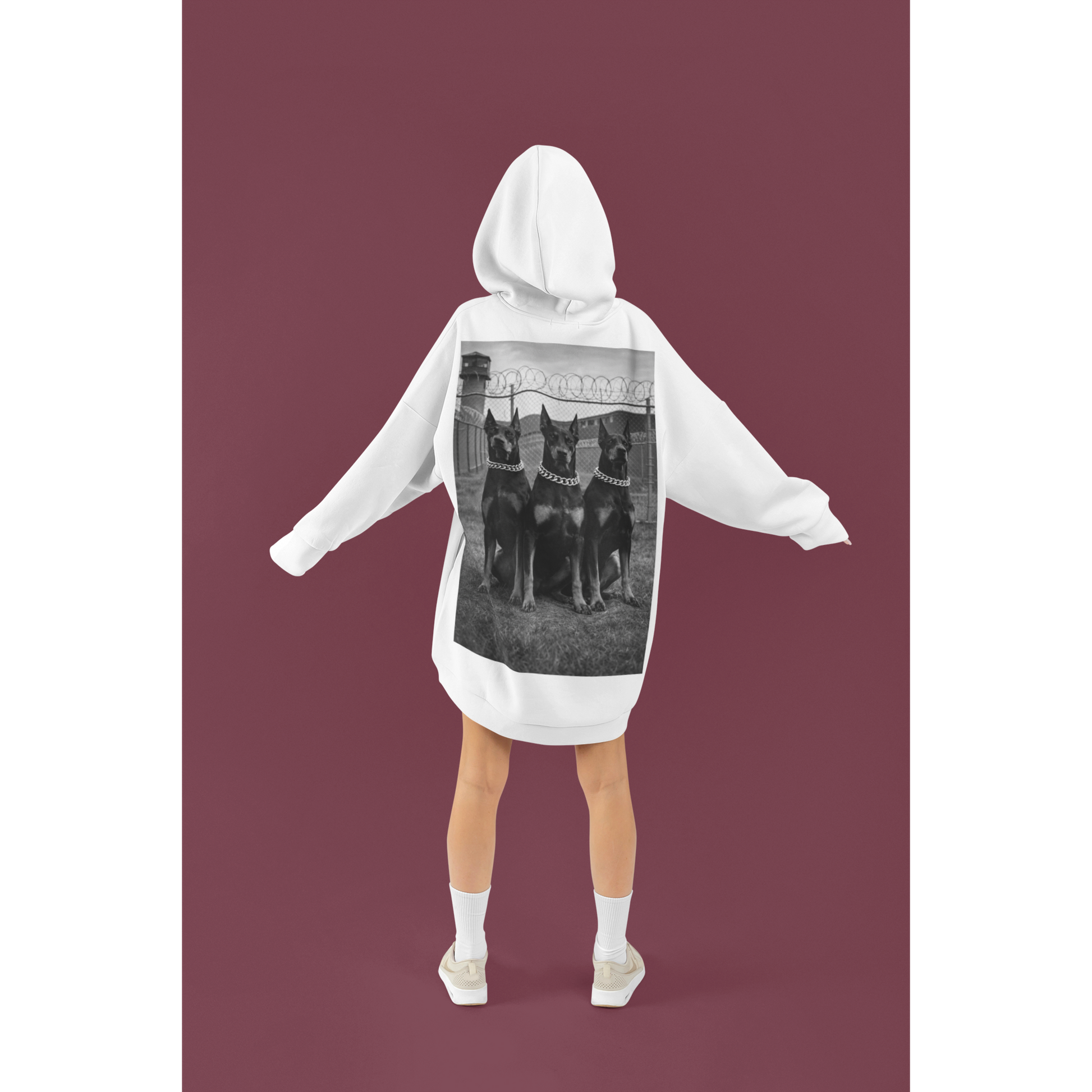 Model wearing oversized doberman guard dog motivational hoodie showcasing bold back graphic and streetwear aesthetic