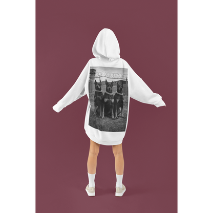 Model wearing oversized doberman guard dog motivational hoodie showcasing bold back graphic and streetwear aesthetic