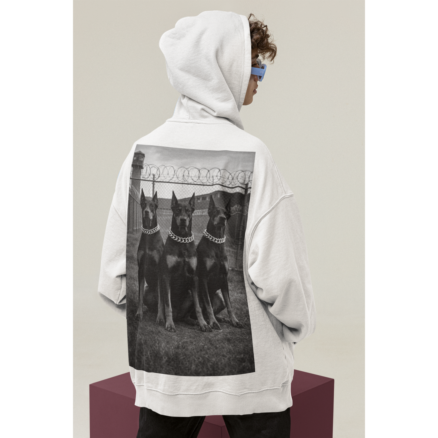 Side view of oversized hoodie featuring doberman guard dog back graphic symbolizing control focus and resilience