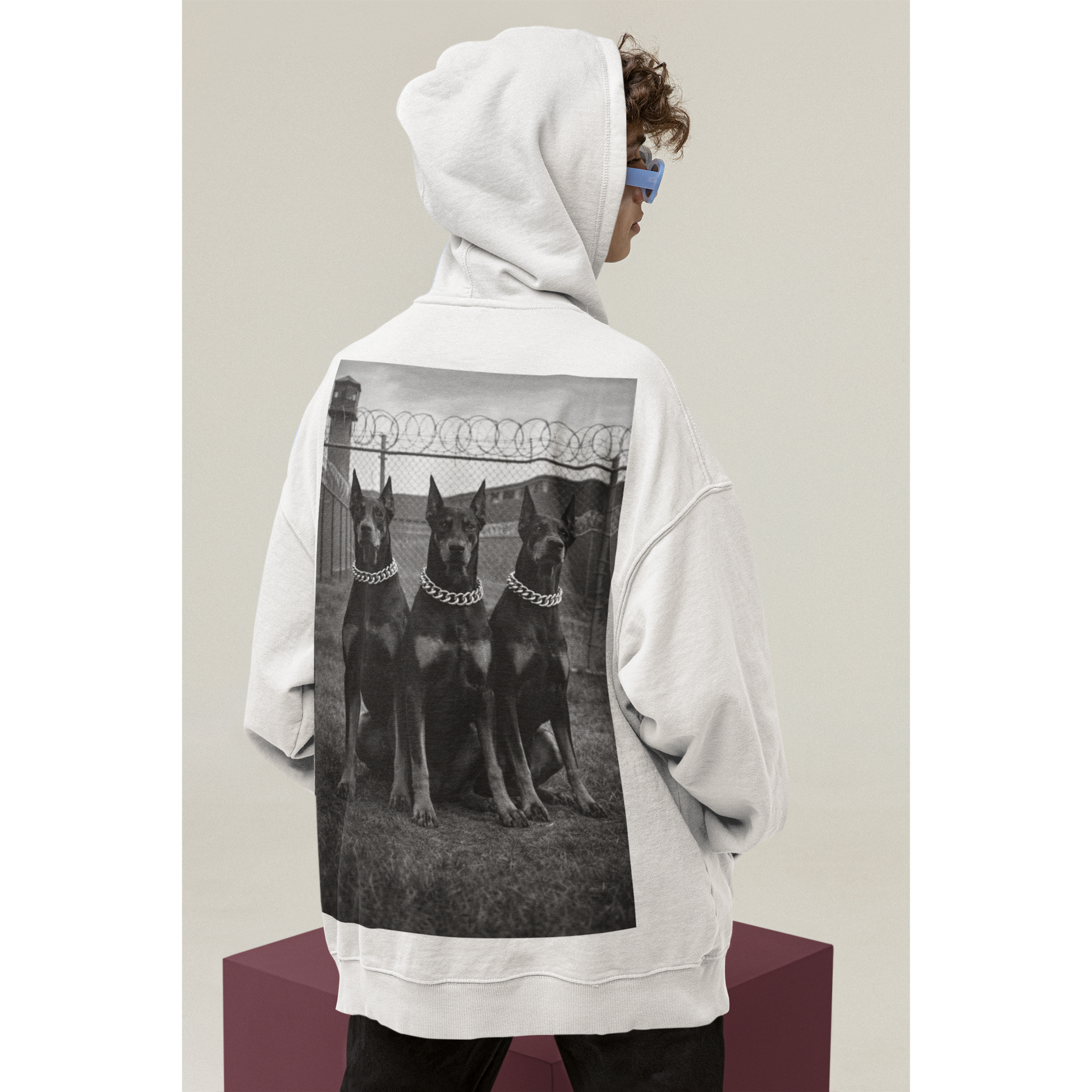 Side view of oversized hoodie featuring doberman guard dog back graphic symbolizing control focus and resilience