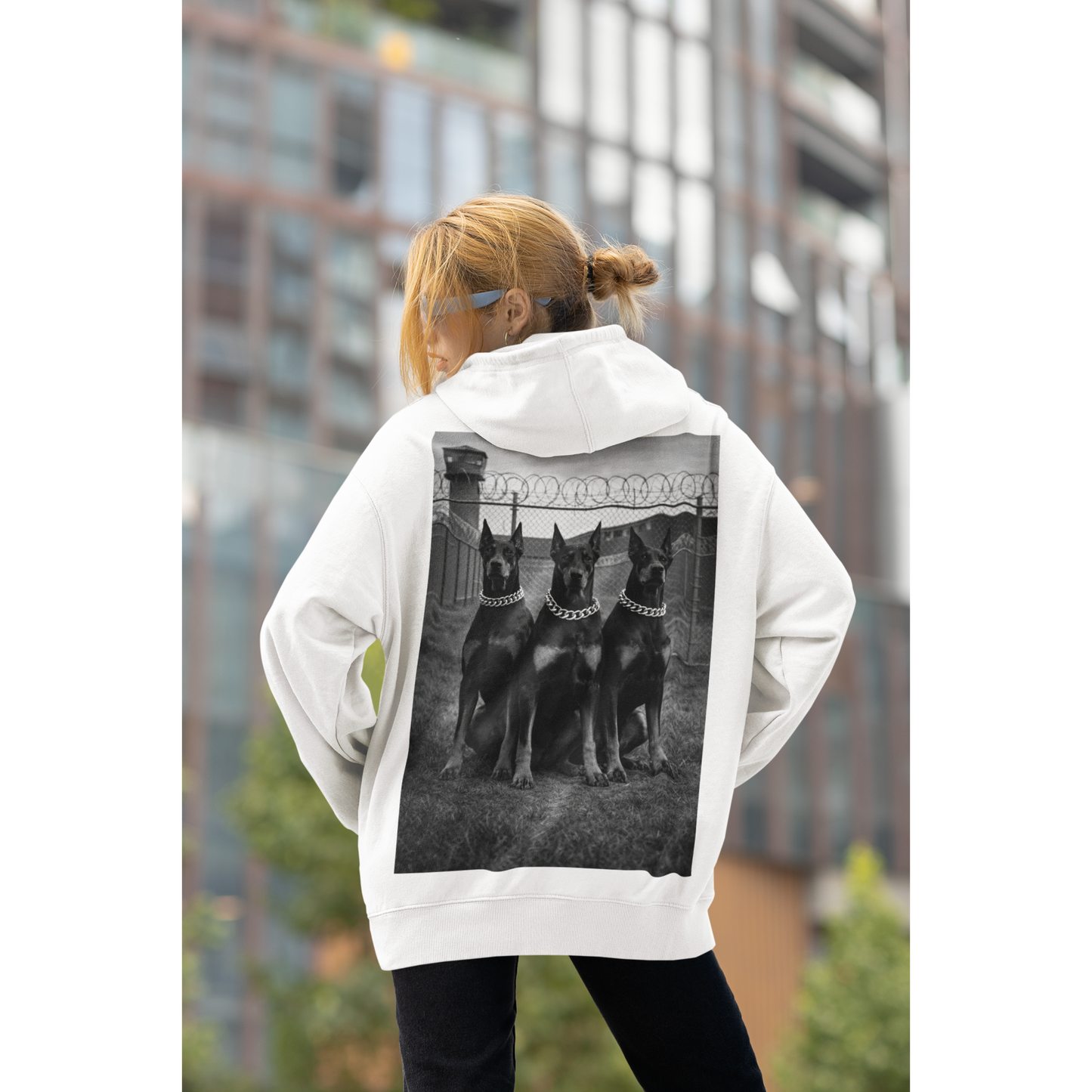 Streetwear lifestyle image of model wearing doberman guard dog hoodie emphasizing discipline confidence and strength