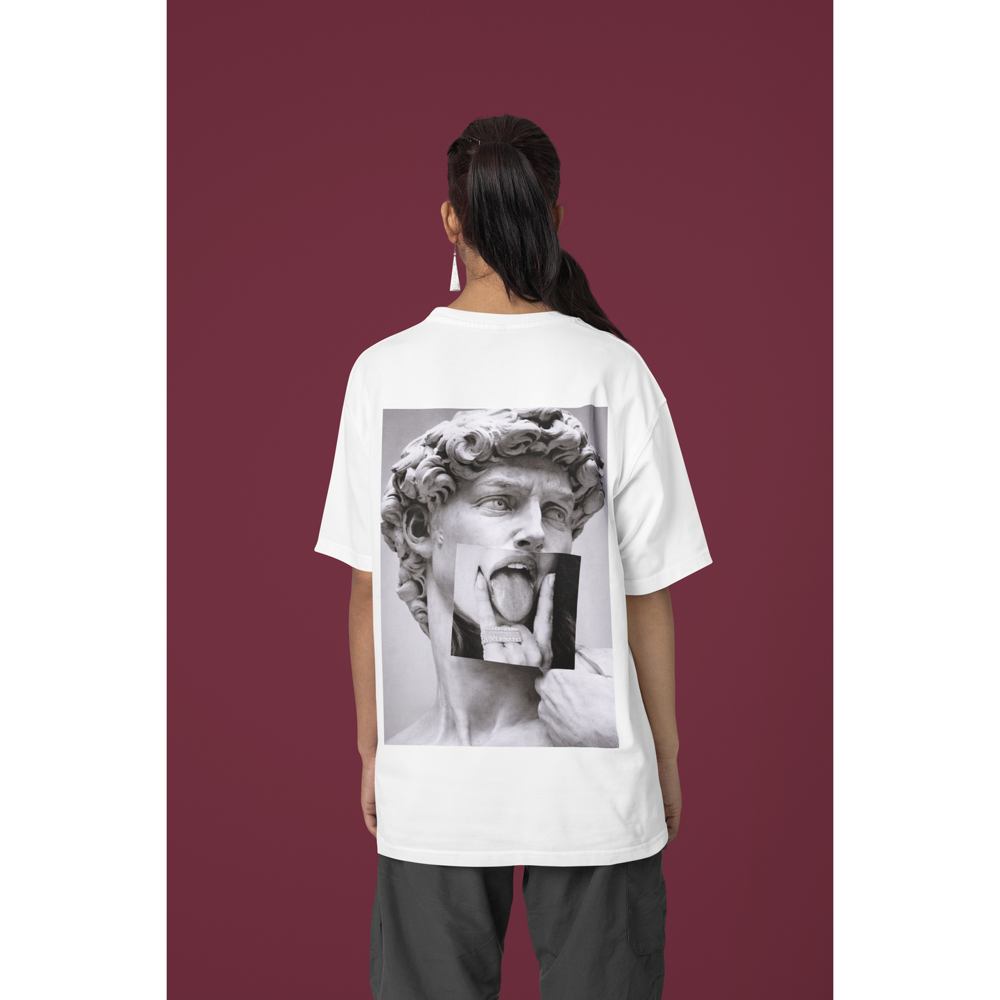 Female model wearing oversized white graphic t-shirt with Michelangelo David statue grunge back print, dark feminine gothic streetwear fashion