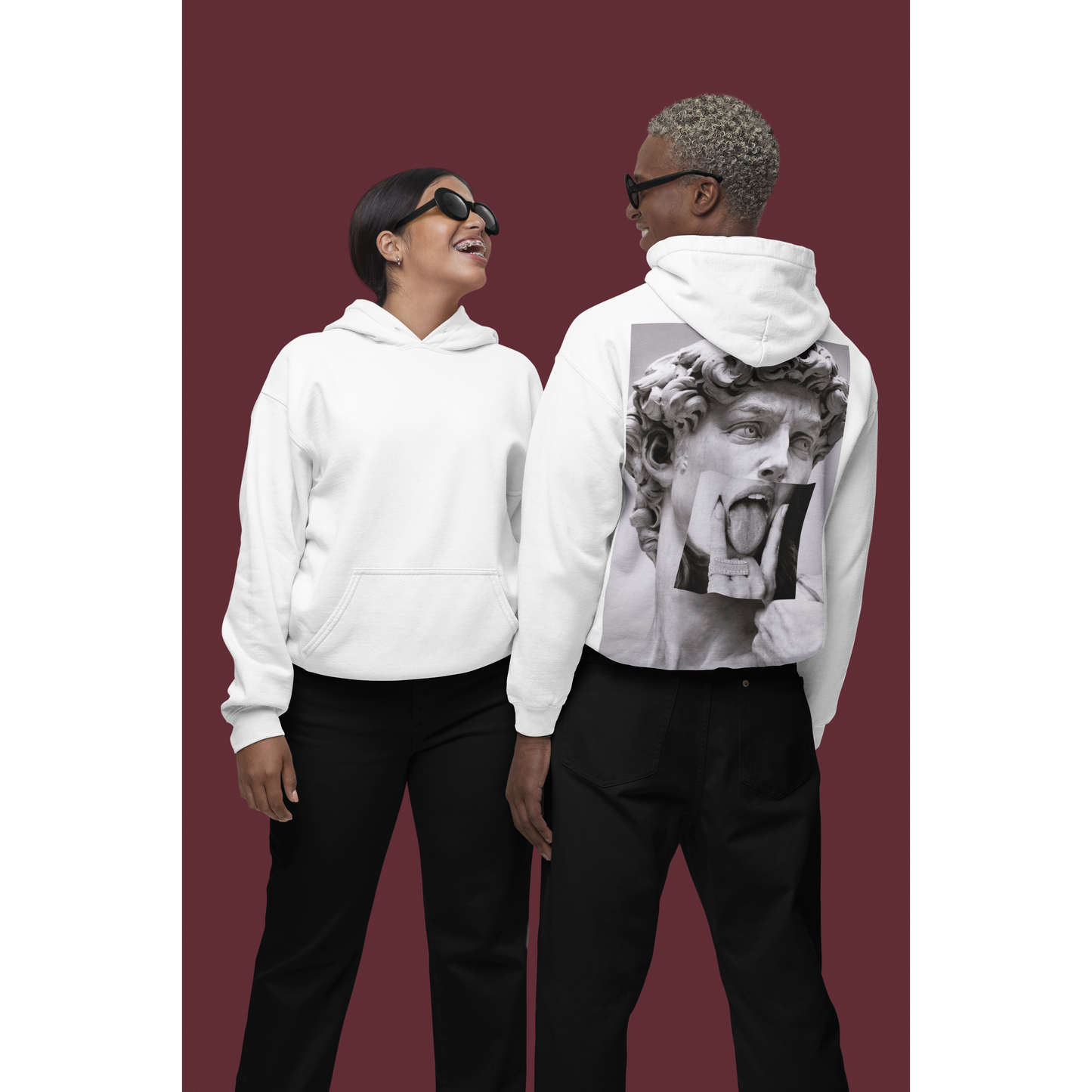 White unisex hoodies worn by models showing classical statue collage back graphic, modern art inspired streetwear hoodies with statement artwork