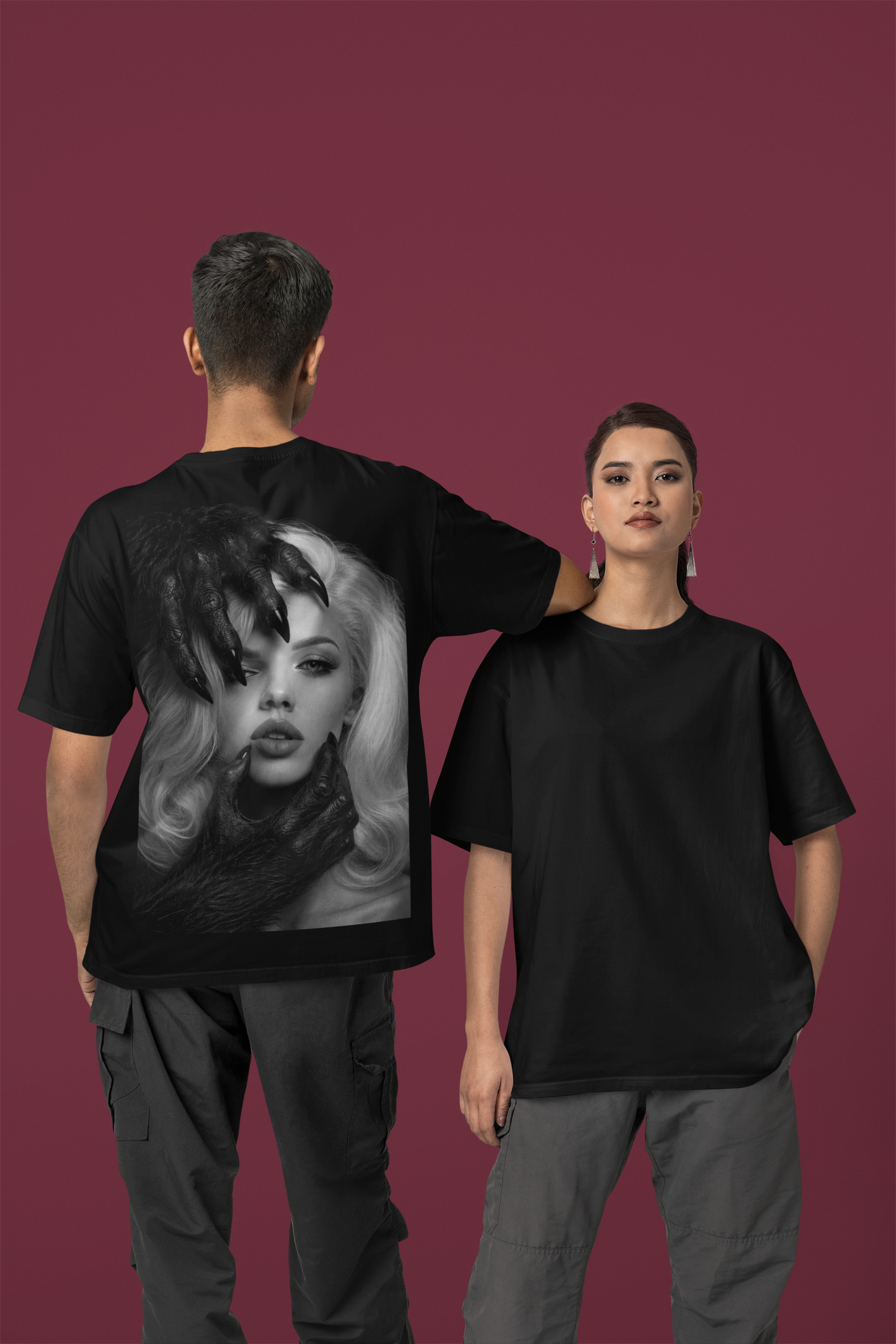 Male and female models wearing black dark feminine back graphic t-shirt shown front and back, unisex gothic portrait statement tee with clean minimalist front and bold back artwork