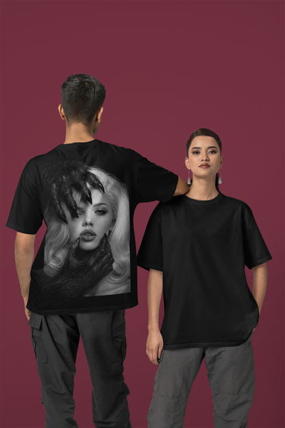 Male and female models wearing black dark feminine back graphic t-shirt shown front and back, unisex gothic portrait statement tee with clean minimalist front and bold back artwork
