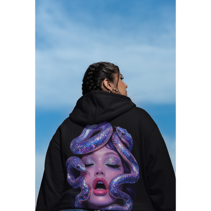 Black statement hoodie worn outdoors featuring surreal serpent glamour back artwork, modern streetwear with iridescent snake portrait