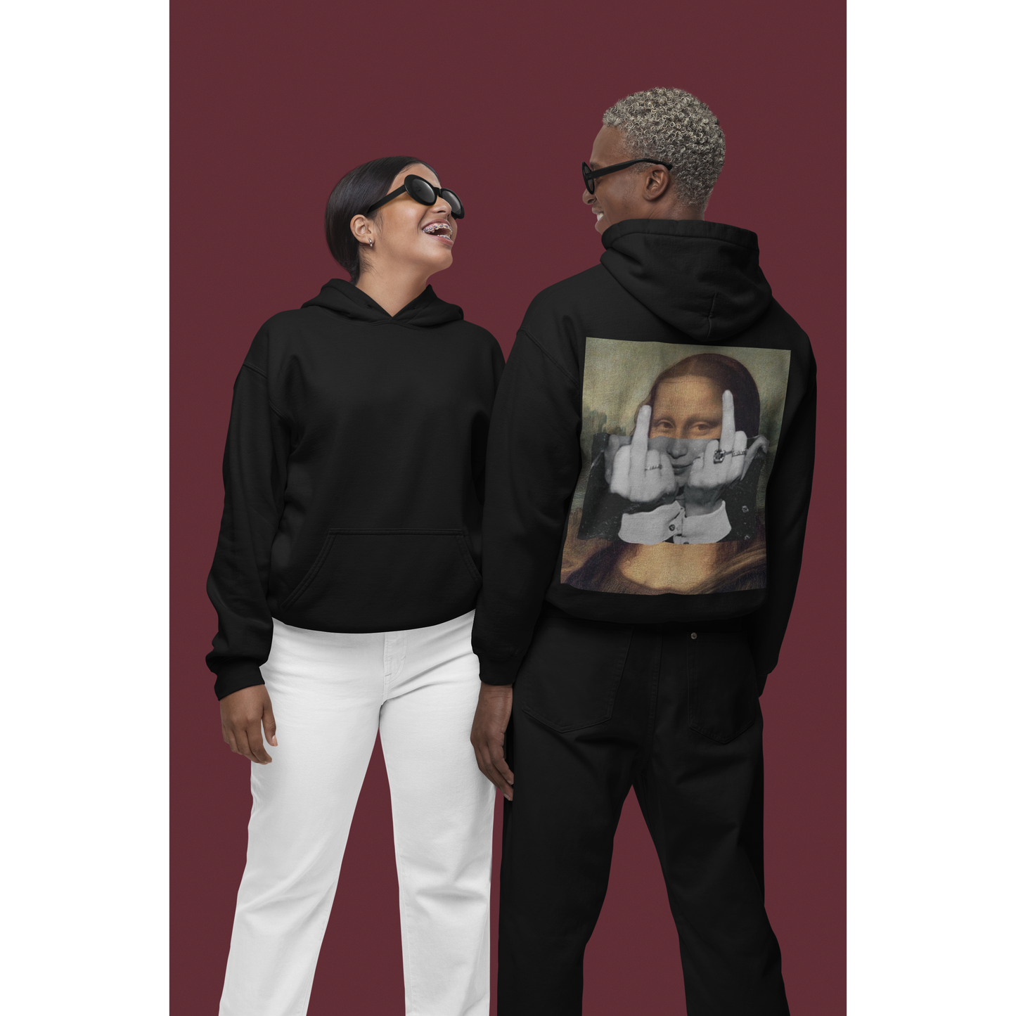 Unisex Mona Lisa middle finger black hoodie shown on male and female models, featuring clean front and bold classical art rebellion back graphic, dark luxury statement streetwear hoodie