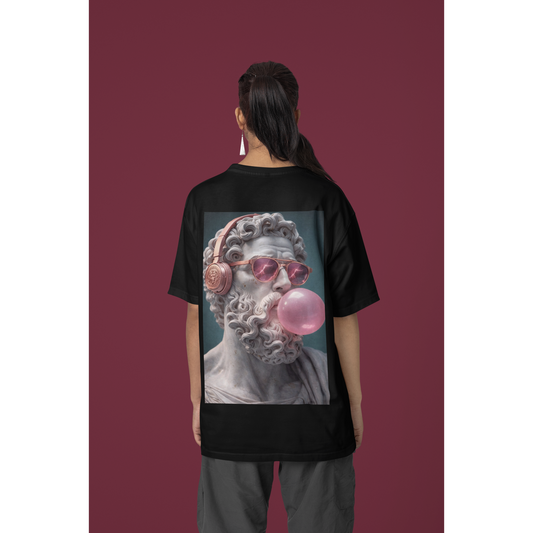 Model wearing black classical statue headphones bubblegum back graphic t-shirt, unisex dark luxury surreal statement tee featuring marble sculpture with headphones and pink bubblegum, clean black front design and bold back graphic