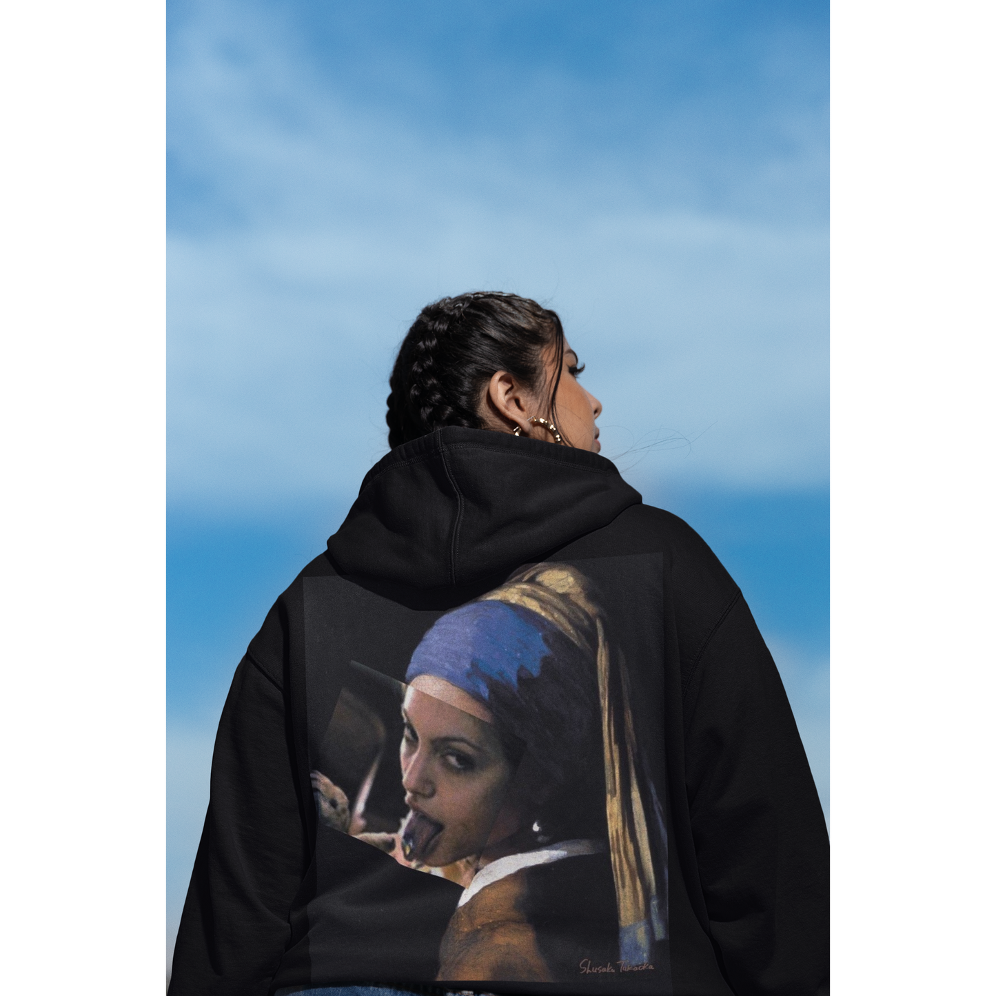 Lifestyle shot of model wearing black Classical Girl with a Pearl unfiltered collage back graphic hoodie, dark luxury streetwear hoodie with bold classical artwork on the back and clean minimalist front
