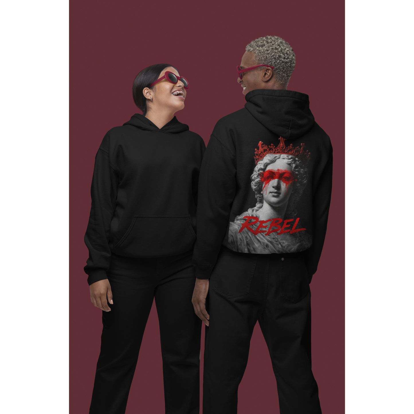 Black unisex rebel hoodie featuring classical statue red paint back graphic, luxury streetwear hoodie styled on models in studio setting