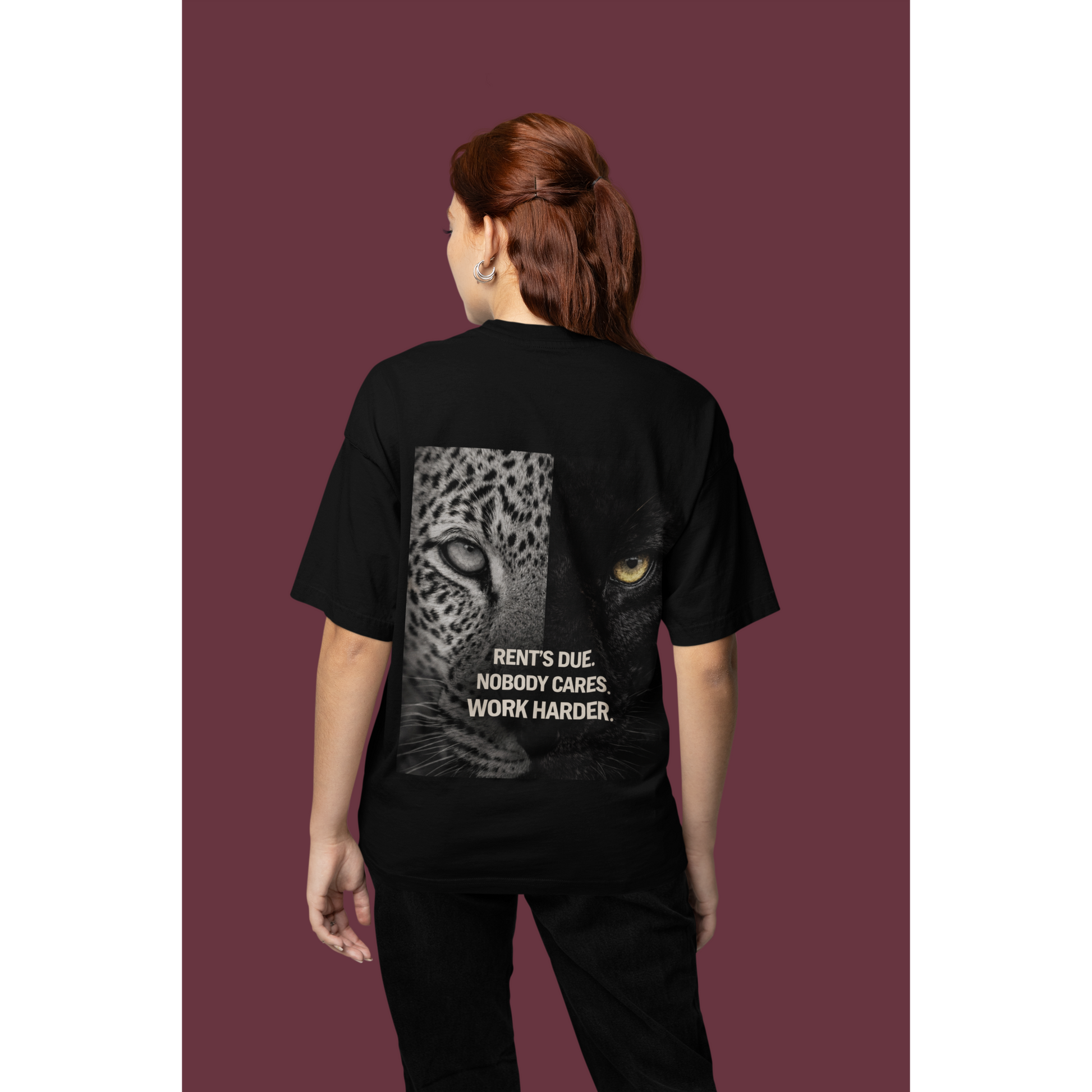 Model wearing black Rent’s Due leopard panther back graphic t-shirt, unisex dark luxury streetwear tee with discipline quote and bold animal artwork on the back, clean black front design