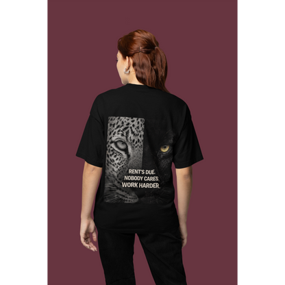 Model wearing black Rent’s Due leopard panther back graphic t-shirt, unisex dark luxury streetwear tee with discipline quote and bold animal artwork on the back, clean black front design