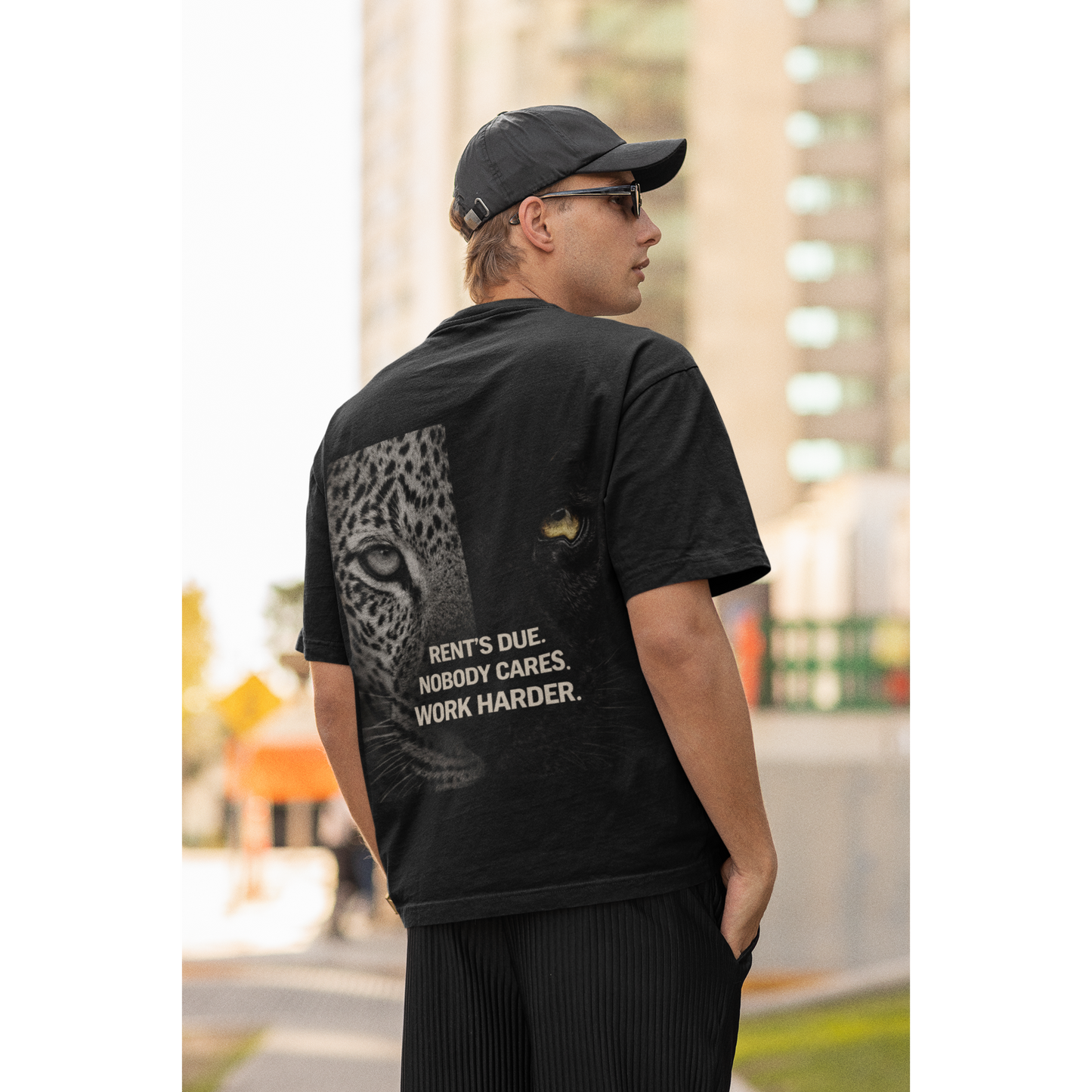 Unisex Rent’s Due black t-shirt shown on male and female models, featuring clean black front and bold leopard panther back graphic with motivational discipline quote, dark luxury streetwear tee