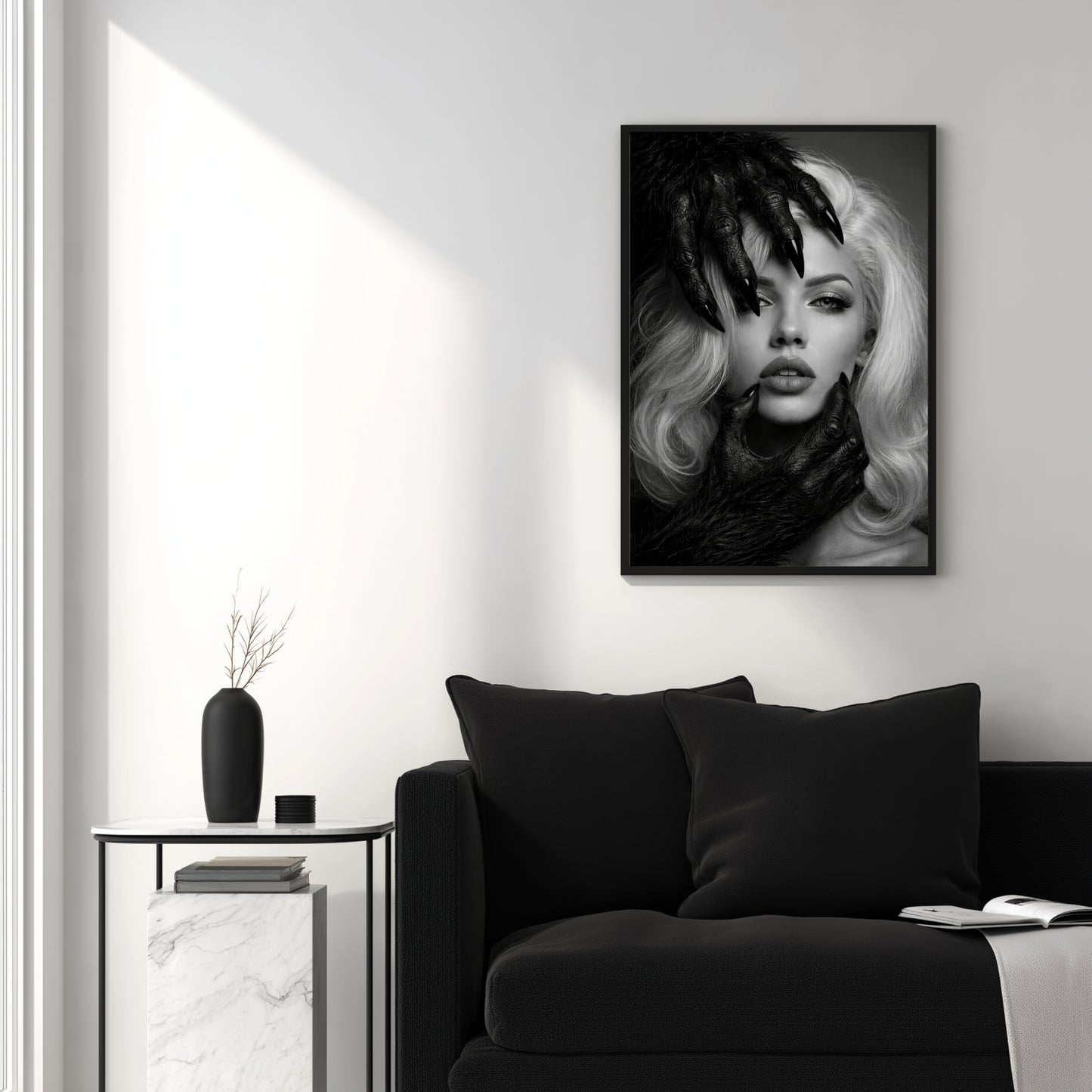 Black and white surreal woman portrait wall art above black sofa in minimal white interior, modern monochrome portrait statement wall decor