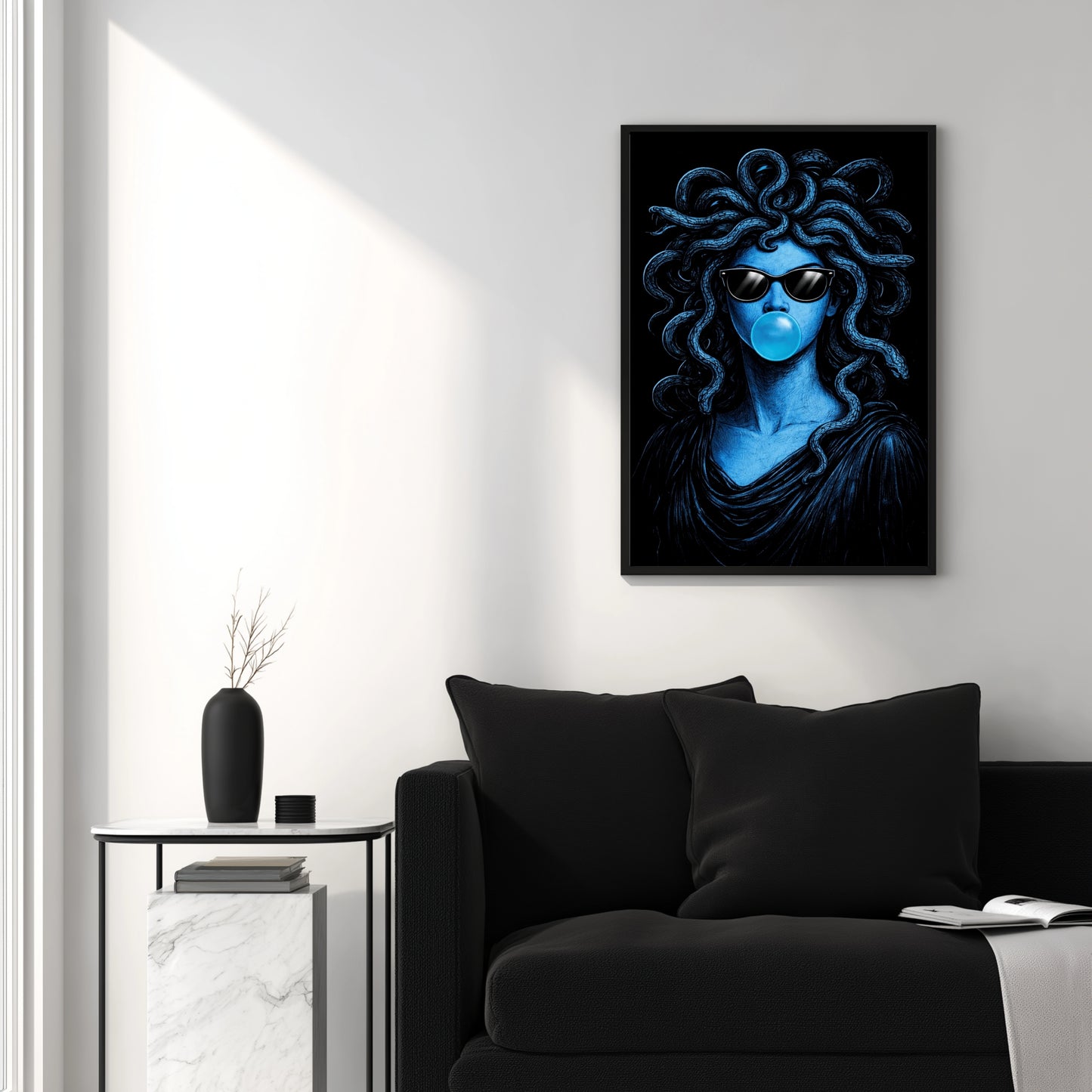Modern Medusa blue pop art wall decor above black sofa in minimal white living room, surreal snake portrait statement print