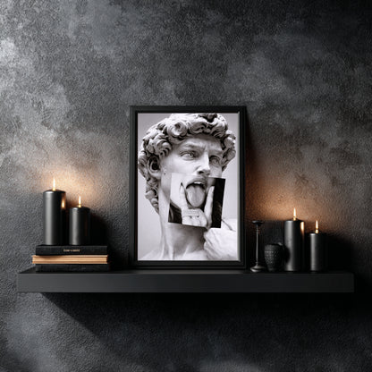 Classical sculpture collage wall art styled above floating shelf with candles and books, modern black and white statement decor