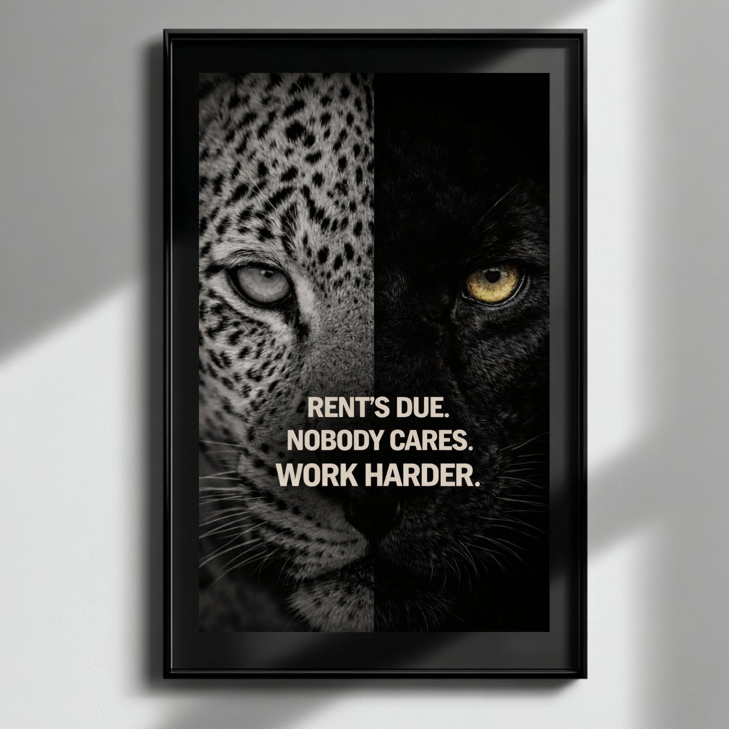 Modern motivational animal wall decor featuring rent’s due work harder quote hung above black sofa in minimalist white interior setting.