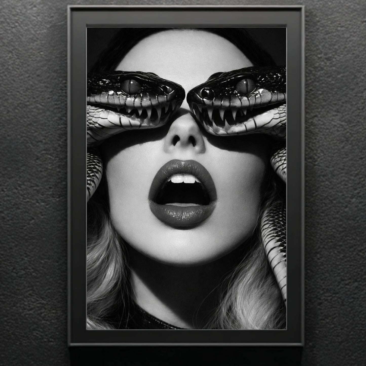 Framed surreal snake portrait print on neutral wall featuring monochrome female face and detailed serpent eye composition