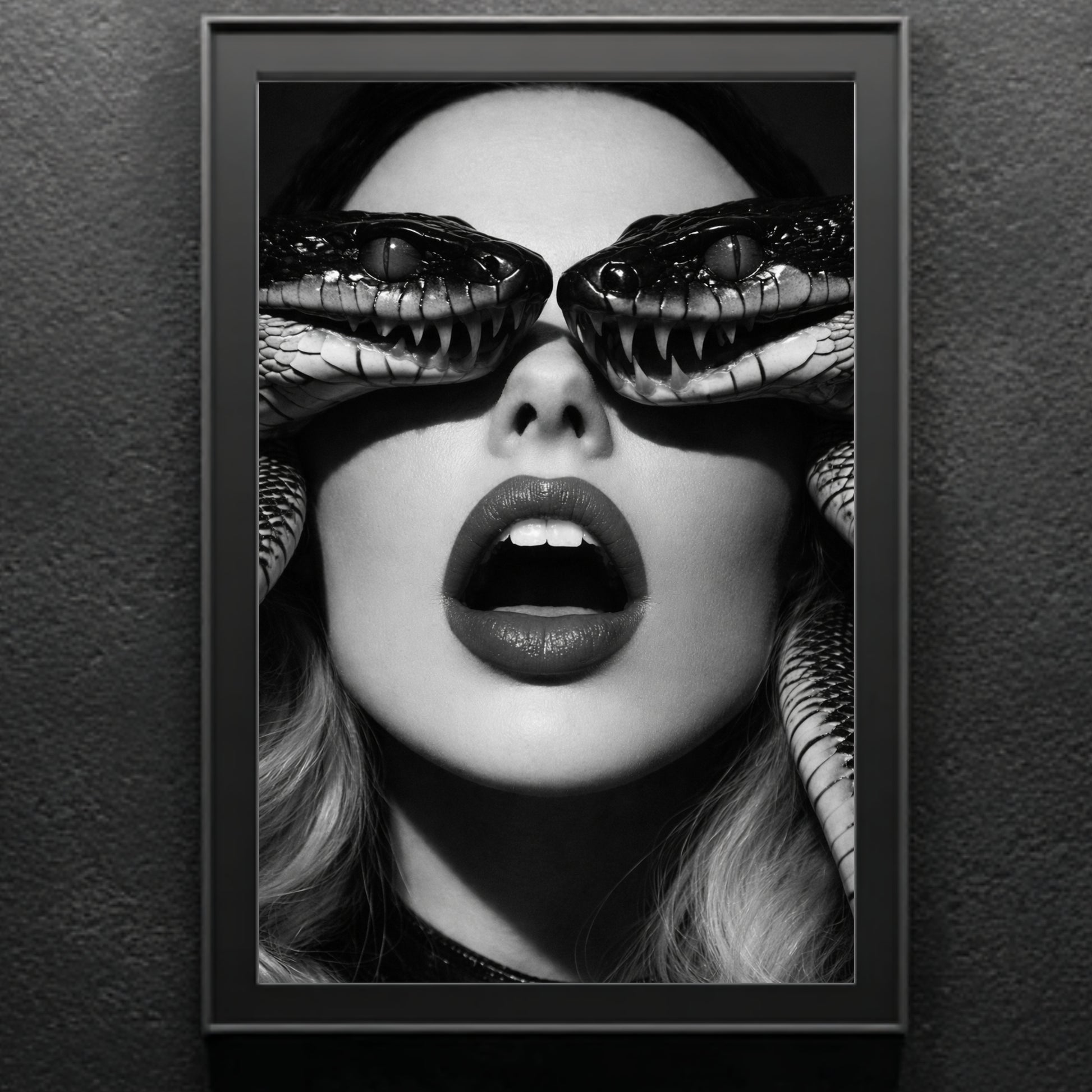 Framed surreal snake portrait print on neutral wall featuring monochrome female face and detailed serpent eye composition