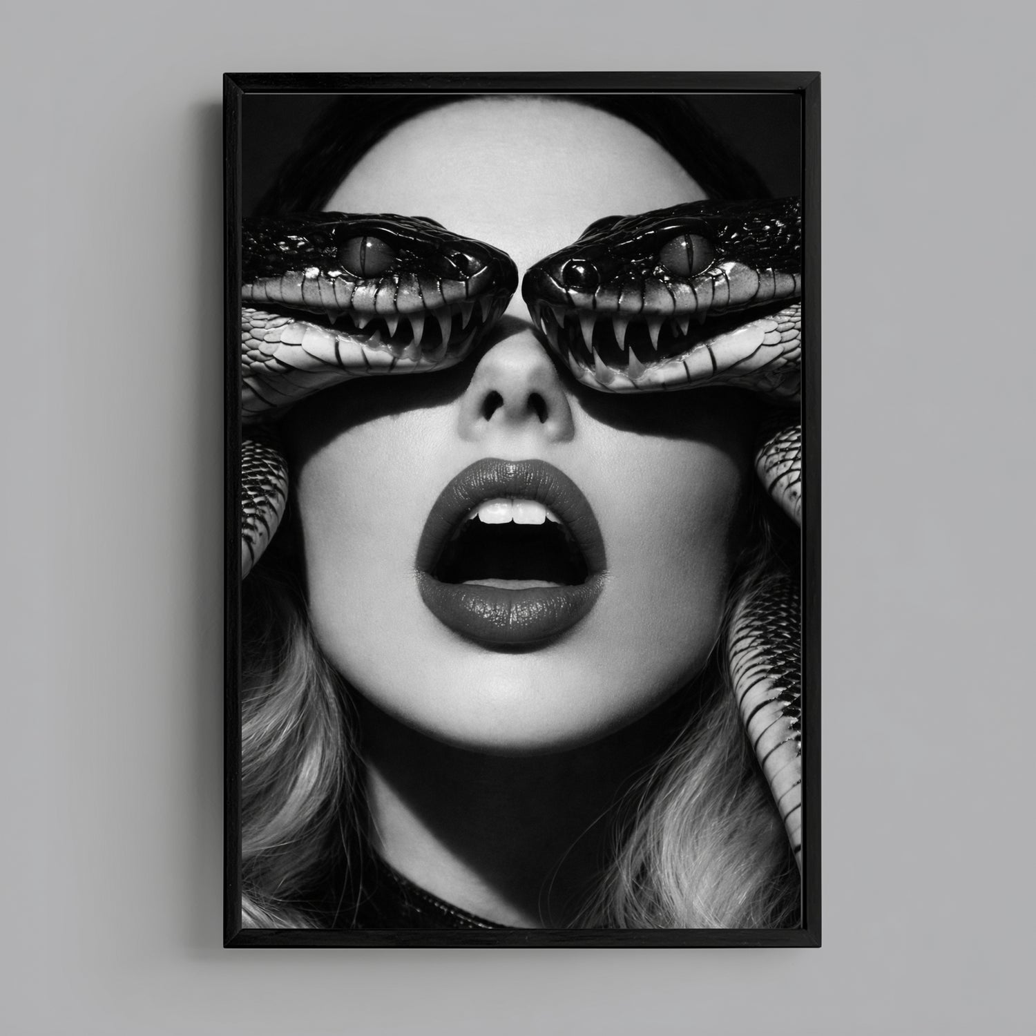 Vertical surreal serpent eye wall art in black frame, monochrome snake portrait statement decor