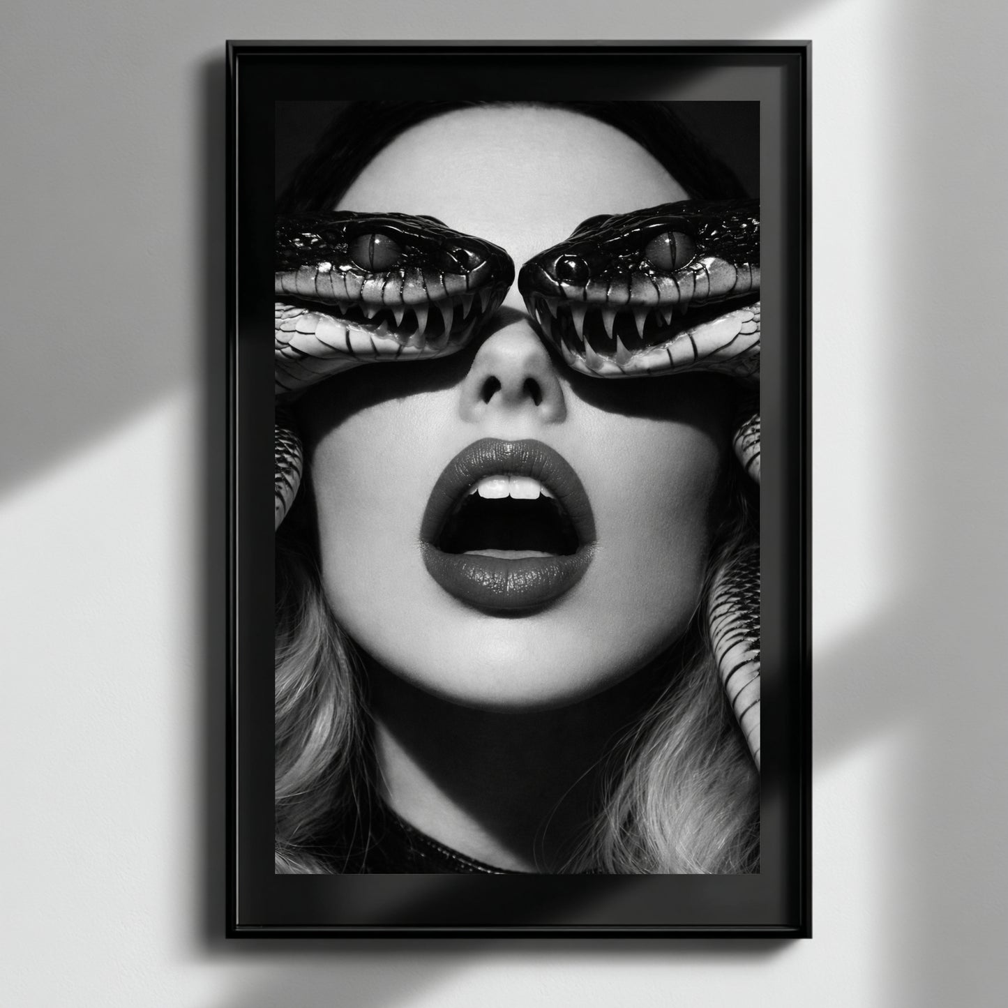 Black and white surreal snake portrait wall art in black frame, high contrast serpent eye statement print for modern interiors