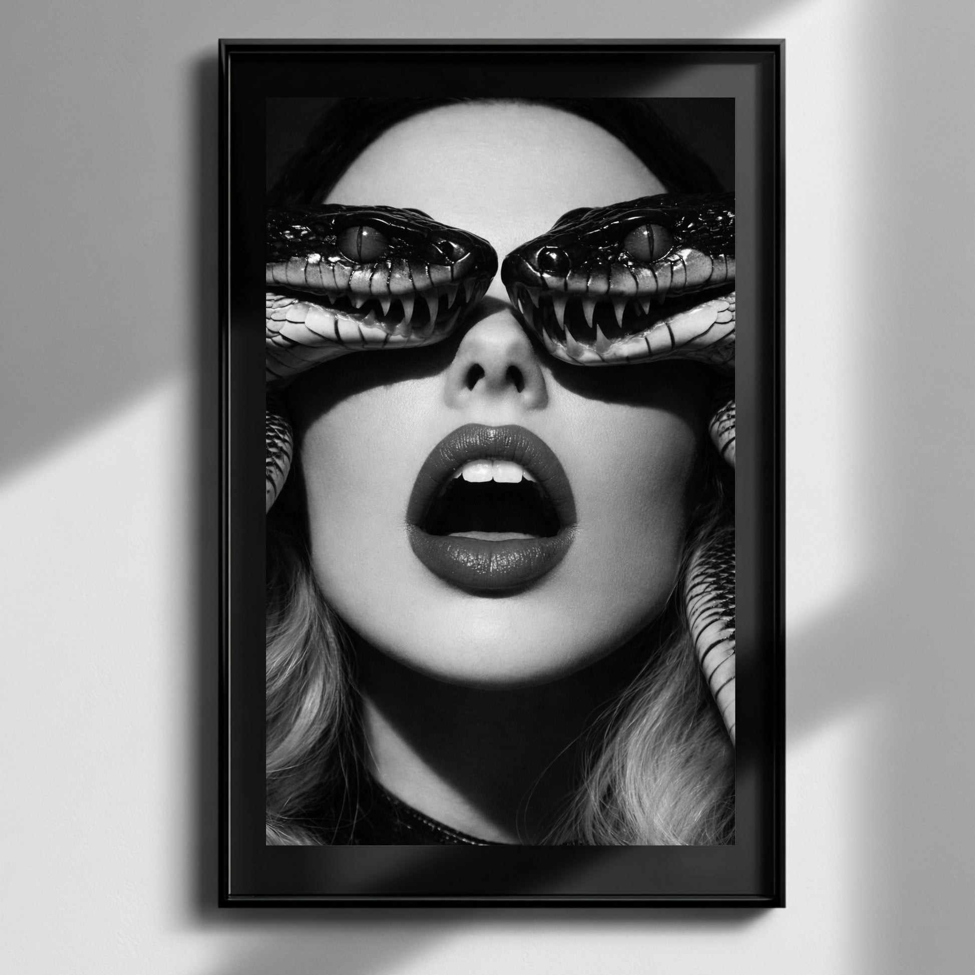 Black and white surreal snake portrait wall art in black frame, high contrast serpent eye statement print for modern interiors