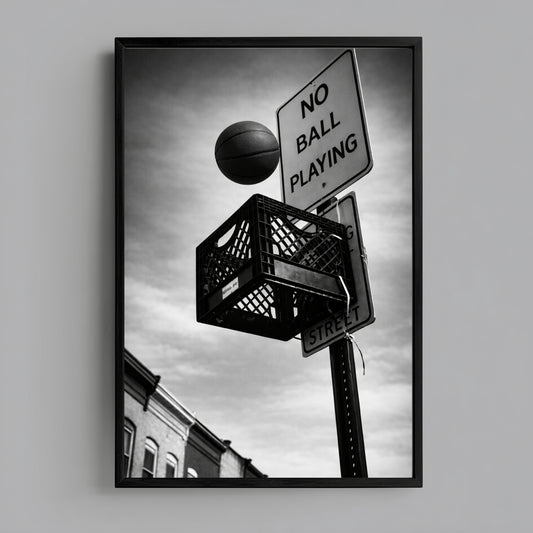 Framed black and white street basketball photography on neutral wall, urban milk crate hoop and no ball playing sign contemporary statement decor