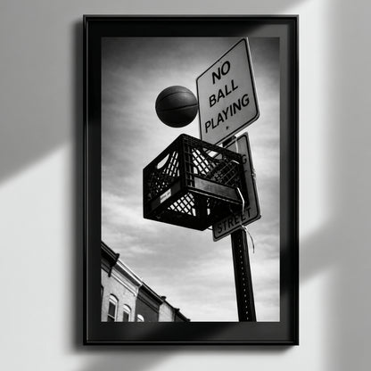 Framed black and white urban basketball artwork with soft light reflection, milk crate hoop and no ball playing sign modern monochrome decor