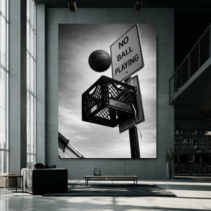 Oversized black and white street basketball canvas in modern industrial loft, milk crate hoop beneath no ball playing sign bold urban statement art