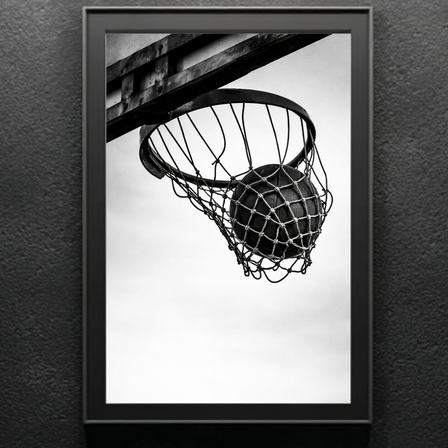 Gallery-style black and white basketball hoop wall art framed in classic molding, minimal monochrome sports photography statement print