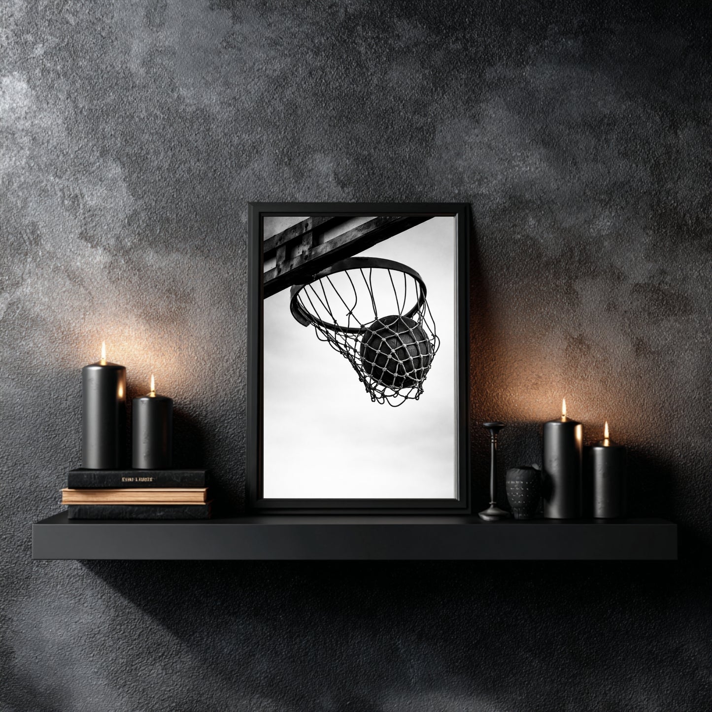 Black and white basketball hoop wall art styled on dark floating shelf with black candles, minimal sports wall decor print featuring ball in net