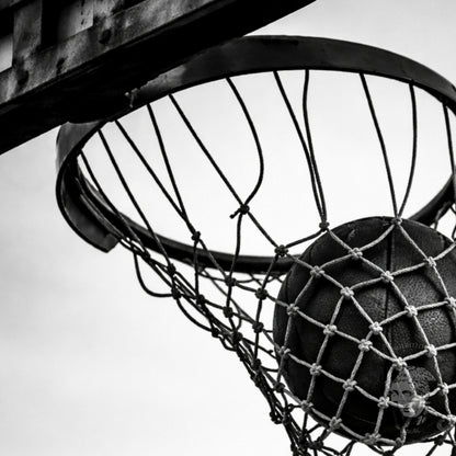 Gallery-style black and white basketball hoop wall art framed in classic molding, minimal monochrome sports photography statement print