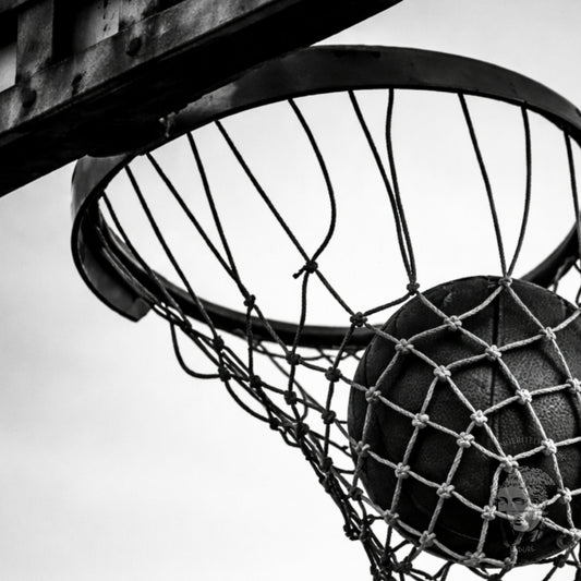 Gallery-style black and white basketball hoop wall art framed in classic molding, minimal monochrome sports photography statement print
