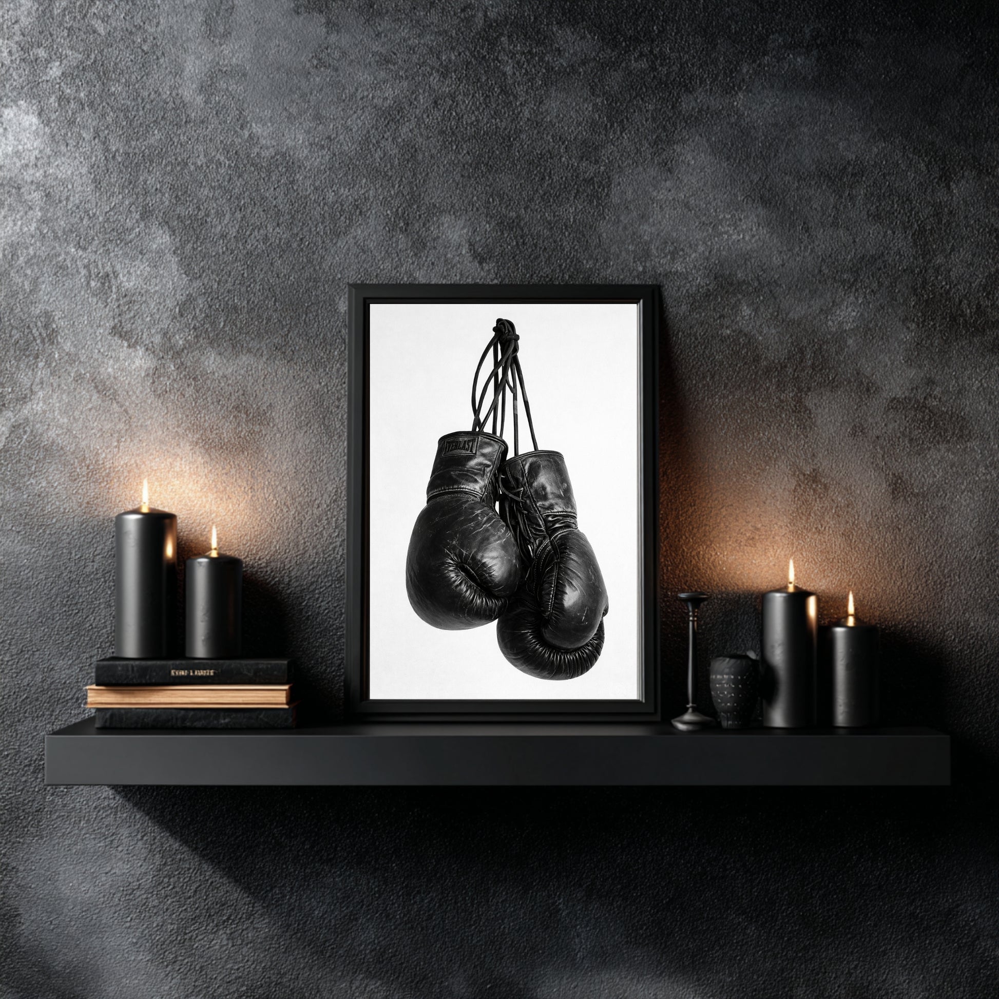 Minimalist black and white boxing gloves wall art styled on modern shelf with black candles, monochrome sports photography print for contemporary wall decor