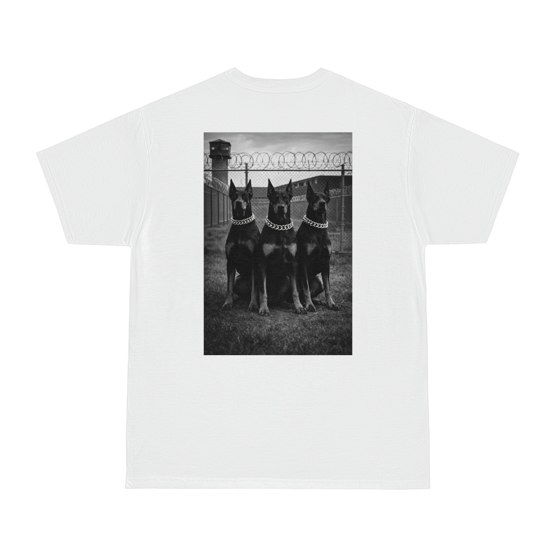White unisex streetwear t-shirt with black and white Doberman trio back graphic, dark motivational artwork symbolizing discipline, loyalty, strength, and endurance