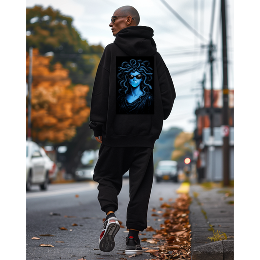 Model wearing black blue medusa bubblegum back graphic hoodie, dark luxury statement hoodie featuring blue medusa with sunglasses blowing bubblegum, unisex pullover hoodie with clean black front and bold surreal back artwork