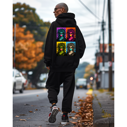 Black pop art Medusa back graphic hoodie worn by model outdoors, unisex bold statement hoodie featuring pop art Medusa collage artwork printed on the back with clean minimalist front