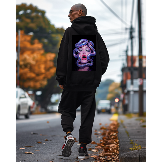 Dark luxury black hoodie worn in city setting with surreal serpent glamour back design, bold modern streetwear statement piece
