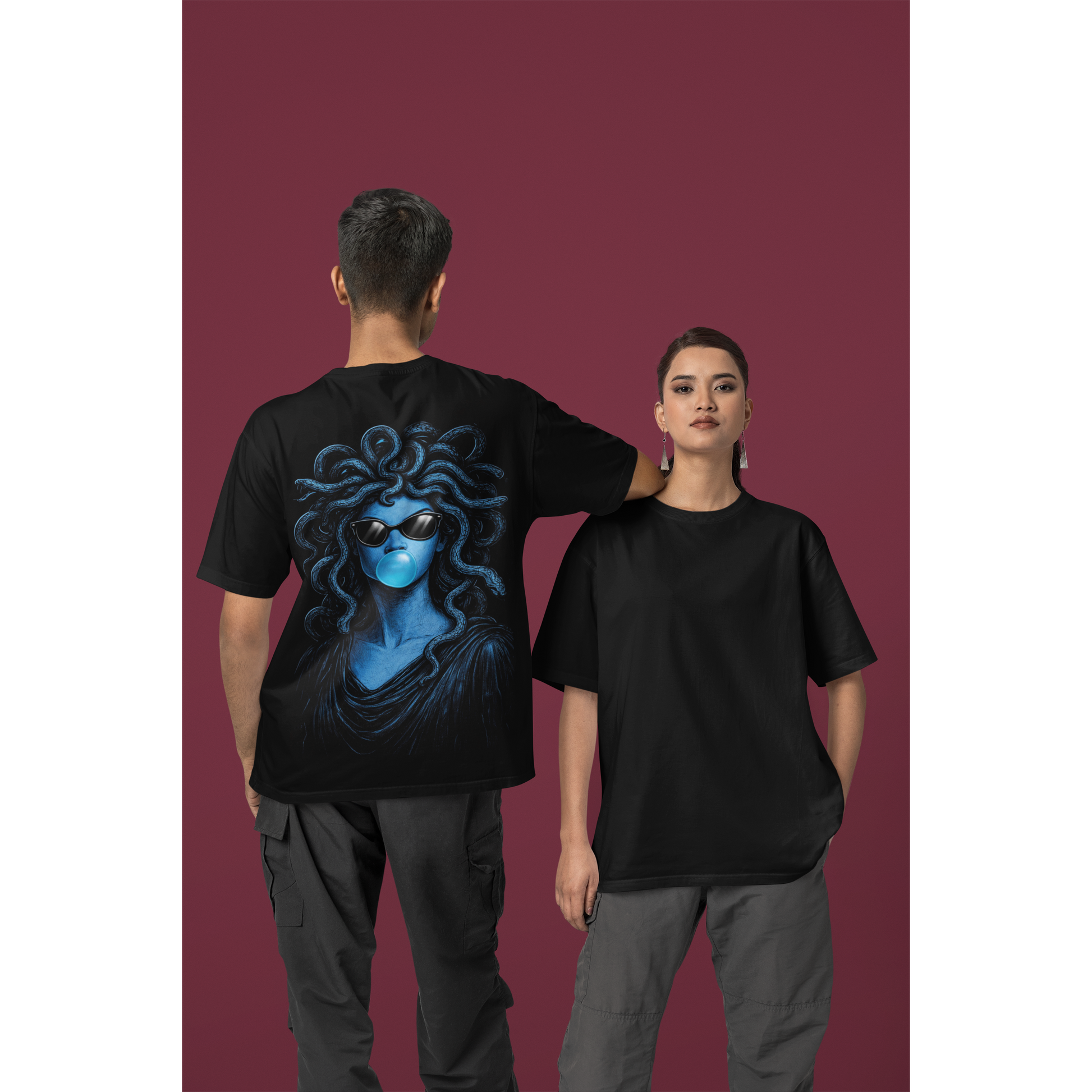 Unisex black blue medusa bubblegum back graphic t-shirt shown on male and female models, dark luxury statement tee featuring blue medusa-inspired figure blowing bubblegum with clean minimalist front and bold surreal back artwork